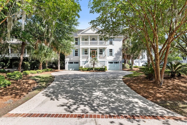 1635 Bull Creek Ln, Charleston, SC 29414 - view of front of house featuring stairway, a balcony, a garage, concrete driveway, and a porch