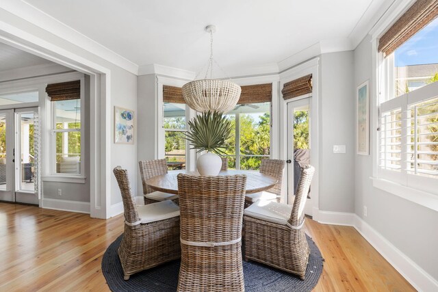 1635 Bull Creek Ln, Charleston, SC 29414 - dining room featuring a chandelier, light wood-style floors, baseboards, and crown molding