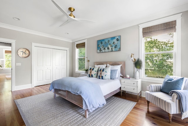 1635 Bull Creek Ln, Charleston, SC 29414 - bedroom with multiple windows, wood finished floors, a closet, and ornamental molding