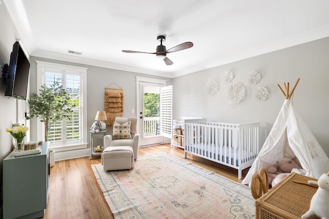 1635 Bull Creek Ln, Charleston, SC 29414 - bedroom with ornamental molding, wood finished floors, ceiling fan, and access to outside