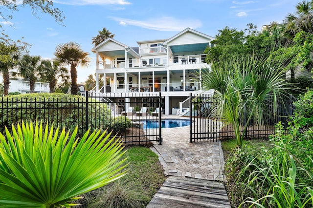1635 Bull Creek Ln, Charleston, SC 29414 - rear view of property featuring a balcony, a patio, a ceiling fan, and stairway