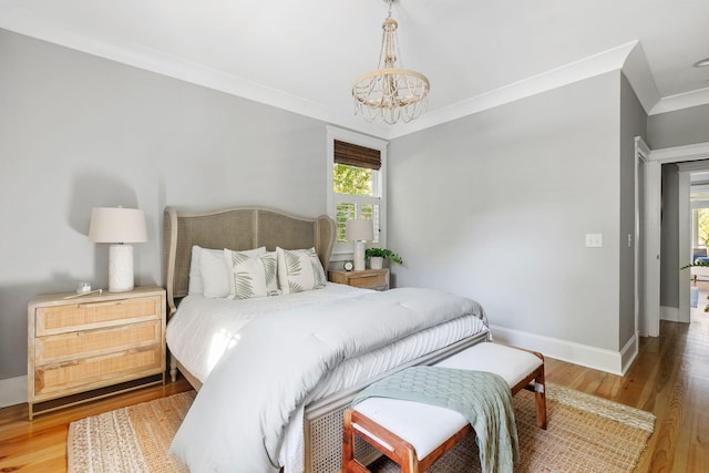1635 Bull Creek Ln, Charleston, SC 29414 - bedroom featuring a chandelier, wood finished floors, baseboards, and ornamental molding