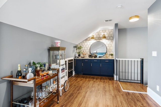 1635 Bull Creek Ln, Charleston, SC 29414 - indoor wet bar with light wood-style floors, lofted ceiling, and tasteful backsplash