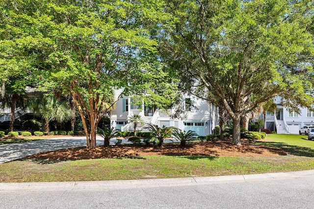 1635 Bull Creek Ln, Charleston, SC 29414 - obstructed view of property with stairs, driveway, and a garage