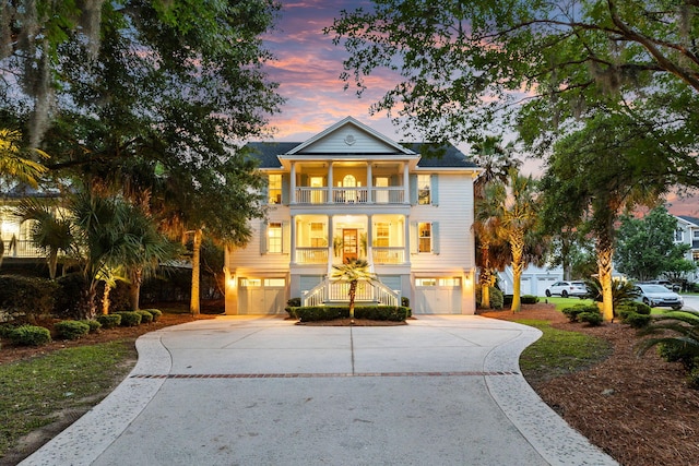 1635 Bull Creek Ln, Charleston, SC 29414 - view of front of property featuring a balcony, an attached garage, concrete driveway, and stairs