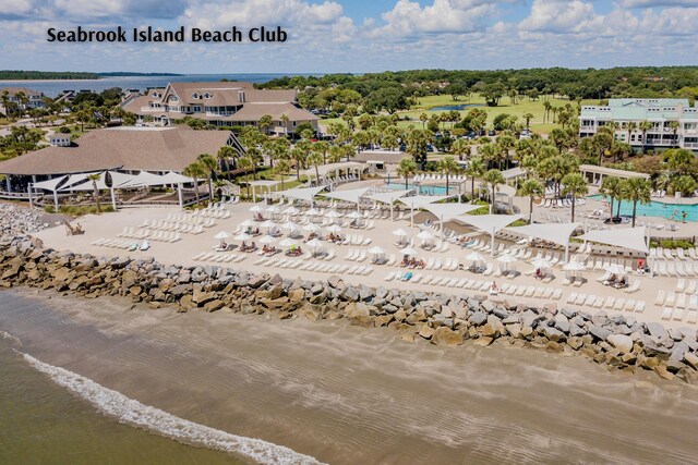 birds eye view of property with a view of the beach and a water view