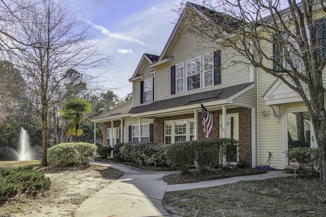 view of front of home featuring brick siding