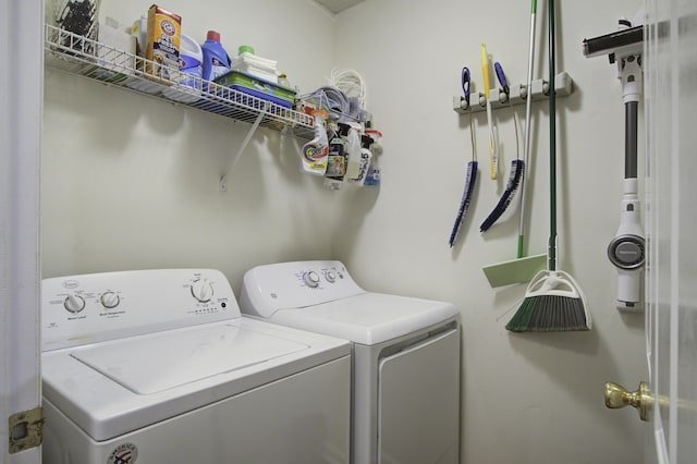 clothes washing area with laundry area and washer and clothes dryer