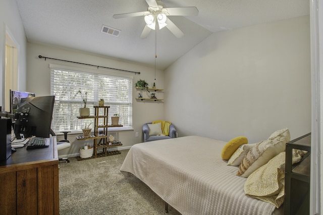 carpeted bedroom featuring vaulted ceiling, baseboards, visible vents, and a ceiling fan