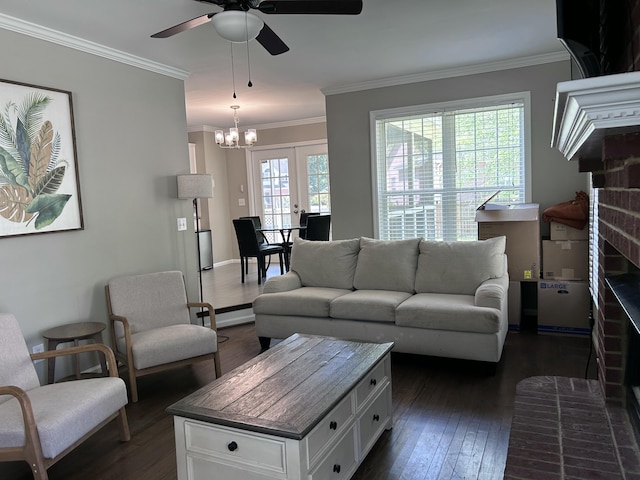 8701 Caspiana Ln, North Charleston, SC 29420 - living room with dark wood-style floors, ceiling fan, crown molding, and a chandelier