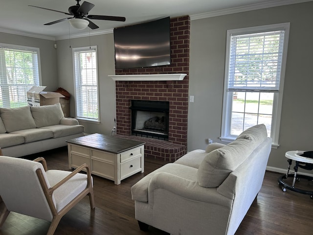 8701 Caspiana Ln, North Charleston, SC 29420 - living room featuring dark wood-type flooring, ornamental molding, a ceiling fan, and a fireplace