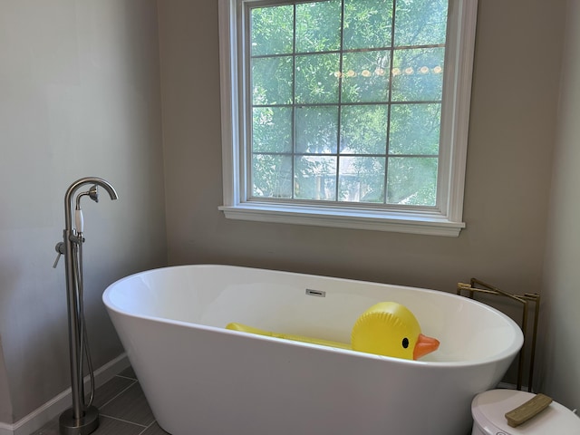 8701 Caspiana Ln, North Charleston, SC 29420 - full bathroom featuring a freestanding tub and tile patterned floors