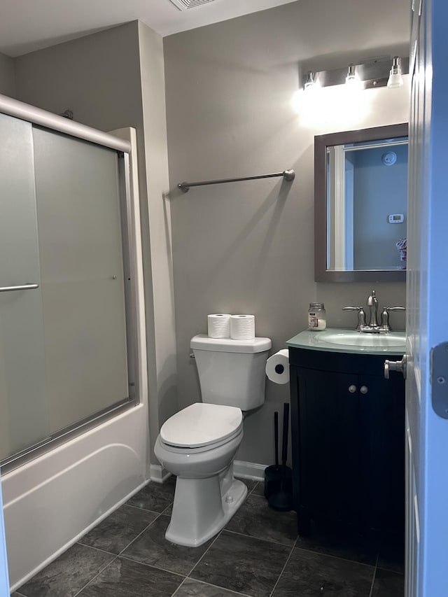 8701 Caspiana Ln, North Charleston, SC 29420 - bathroom featuring vanity, bath / shower combo with glass door, and tile patterned flooring