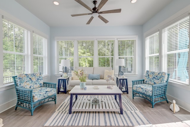 sunroom with ceiling fan