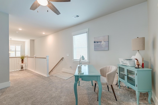 office space featuring light colored carpet and ceiling fan