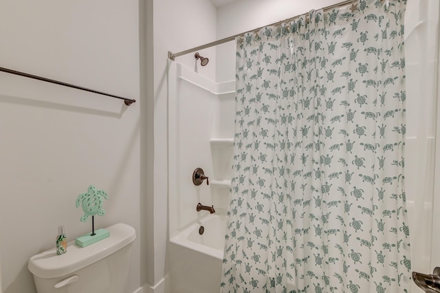 bathroom featuring toilet and shower / bath combination