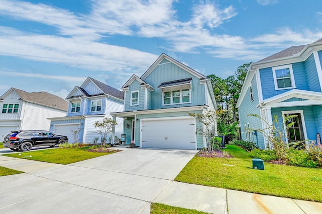 view of front of home with a garage and a front yard