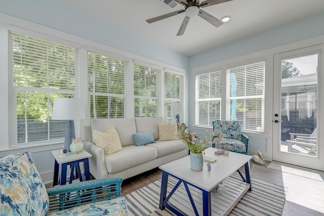 sunroom / solarium with ceiling fan