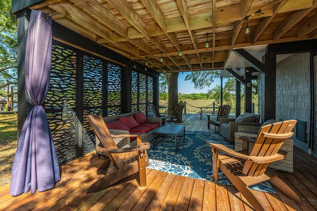 wooden terrace with outdoor lounge area