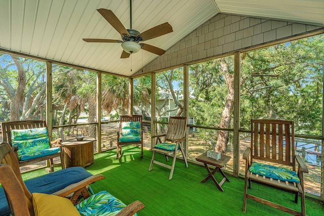 unfurnished sunroom with vaulted ceiling and ceiling fan