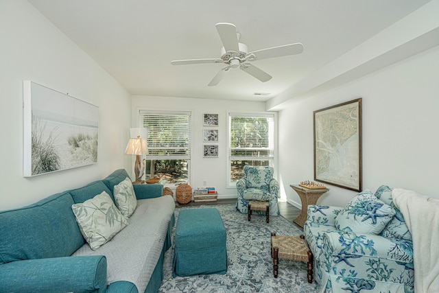 living room featuring hardwood / wood-style floors and ceiling fan