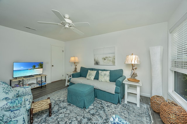 living room with hardwood / wood-style floors and ceiling fan