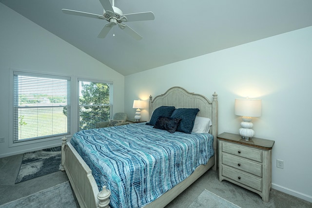 carpeted bedroom featuring ceiling fan and vaulted ceiling