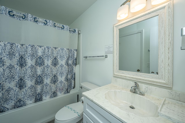 full bathroom with vanity, toilet, and shower / tub combo with curtain