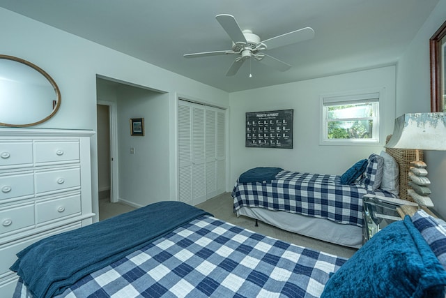 bedroom with a closet, ceiling fan, and carpet