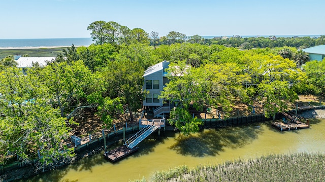 birds eye view of property with a water view