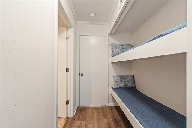 interior space with crown molding and hardwood / wood-style flooring