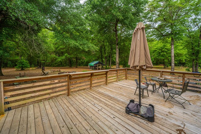 312 Piney Grove Rd, Cross, SC 29436 - wooden deck with view of wooded area and outdoor dining space