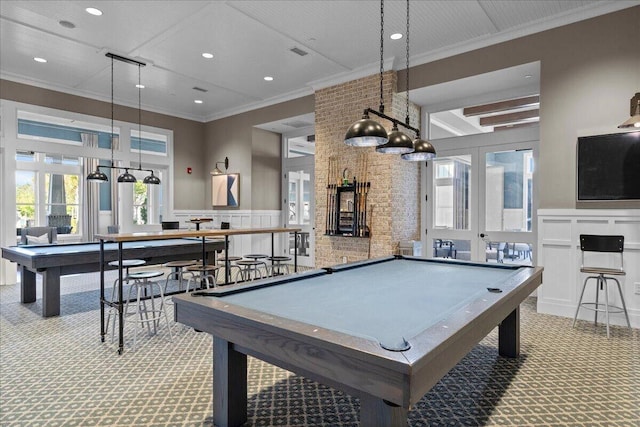 playroom with billiards, a wainscoted wall, ornamental molding, carpet floors, and a decorative wall