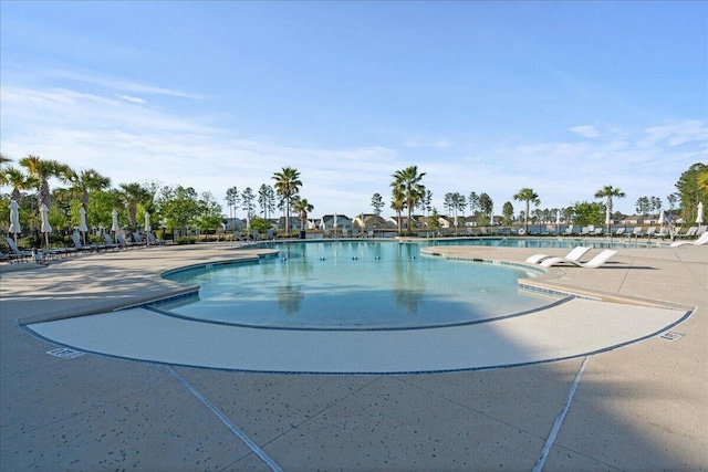 pool with a patio area