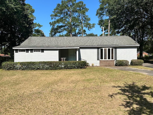 ranch-style house with a front lawn