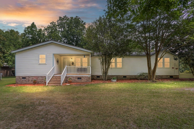 view of front of home with a yard