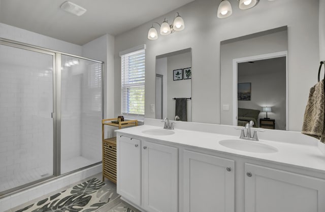 bathroom with vanity and an enclosed shower