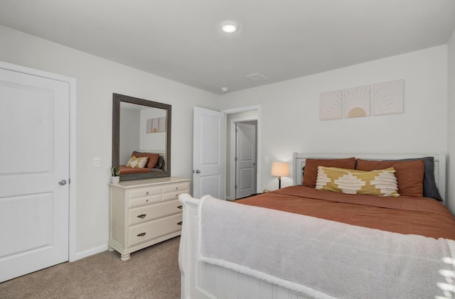 bedroom featuring light colored carpet