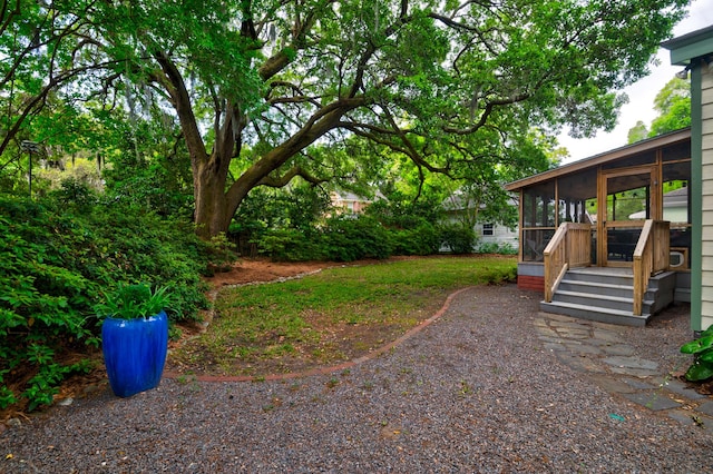 view of yard with a sunroom