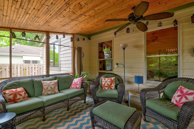 sunroom / solarium featuring an outdoor living space and ceiling fan