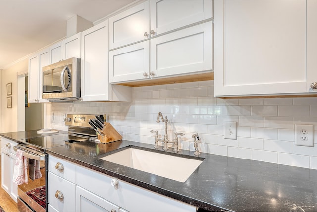 803 Burnett Dr, Charleston, SC 29412 - kitchen featuring stainless steel appliances, a sink, white cabinetry, and decorative backsplash