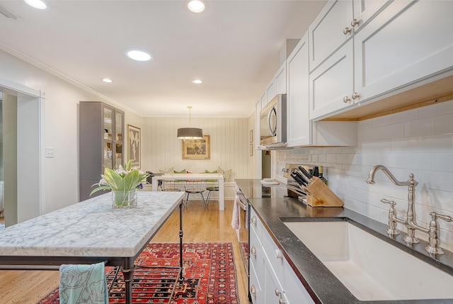 803 Burnett Dr, Charleston, SC 29412 - kitchen with appliances with stainless steel finishes, a sink, recessed lighting, light wood-style floors, and white cabinets