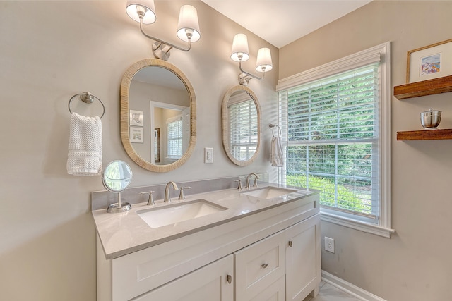 803 Burnett Dr, Charleston, SC 29412 - bathroom with double vanity and baseboards