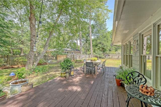 803 Burnett Dr, Charleston, SC 29412 - wooden deck with outdoor dining area and view of wooded area