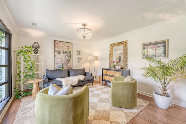 803 Burnett Dr, Charleston, SC 29412 - living room featuring light wood finished floors, crown molding, a chandelier, and baseboards