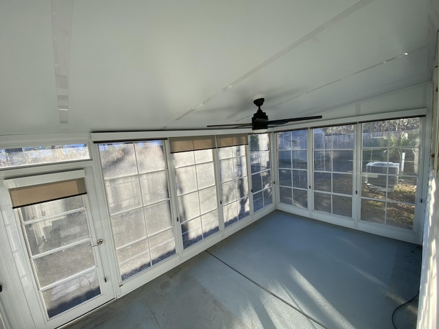 unfurnished sunroom featuring ceiling fan