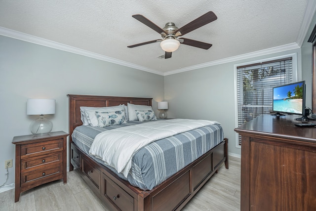 bedroom featuring a textured ceiling, crown molding, ceiling fan, and light wood-type flooring