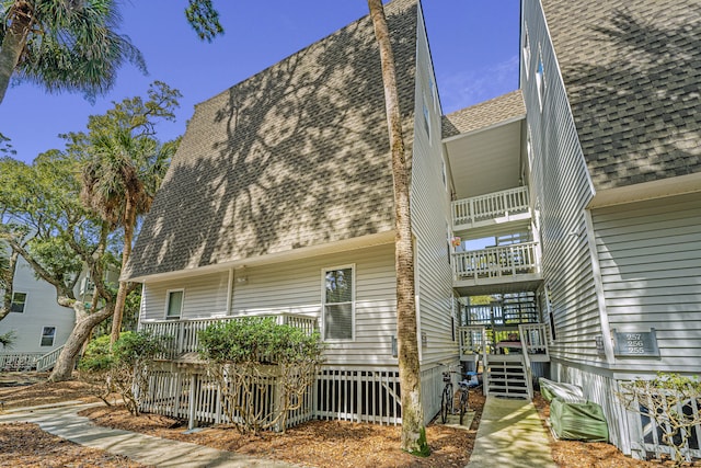 rear view of property with a balcony