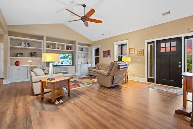 727 Sonny Boy Ln, Johns Island, SC 29455 - living area with wood finished floors, ceiling fan, built in features, healthy amount of natural light, and high vaulted ceiling