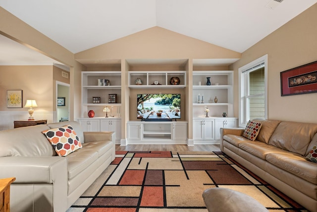 727 Sonny Boy Ln, Johns Island, SC 29455 - living room with built in shelves, vaulted ceiling, and light wood-style floors